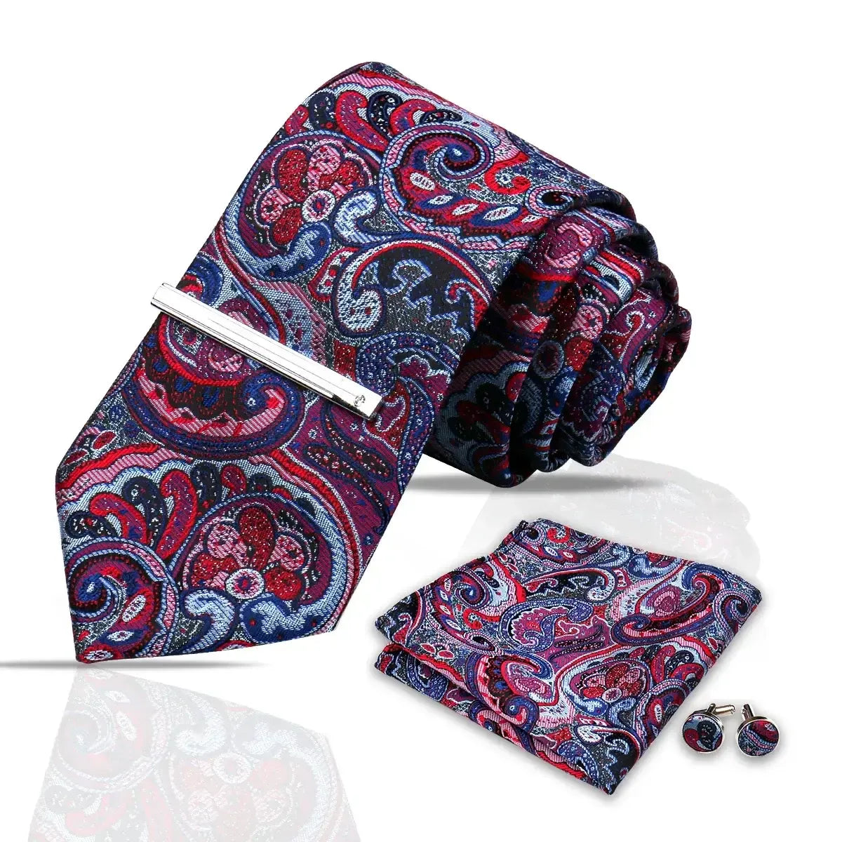Set de corbata 7.5cm, pañuelo y gemelos con estampado paisley en tonos azul, morado y rojo, estilo elegante y formal.