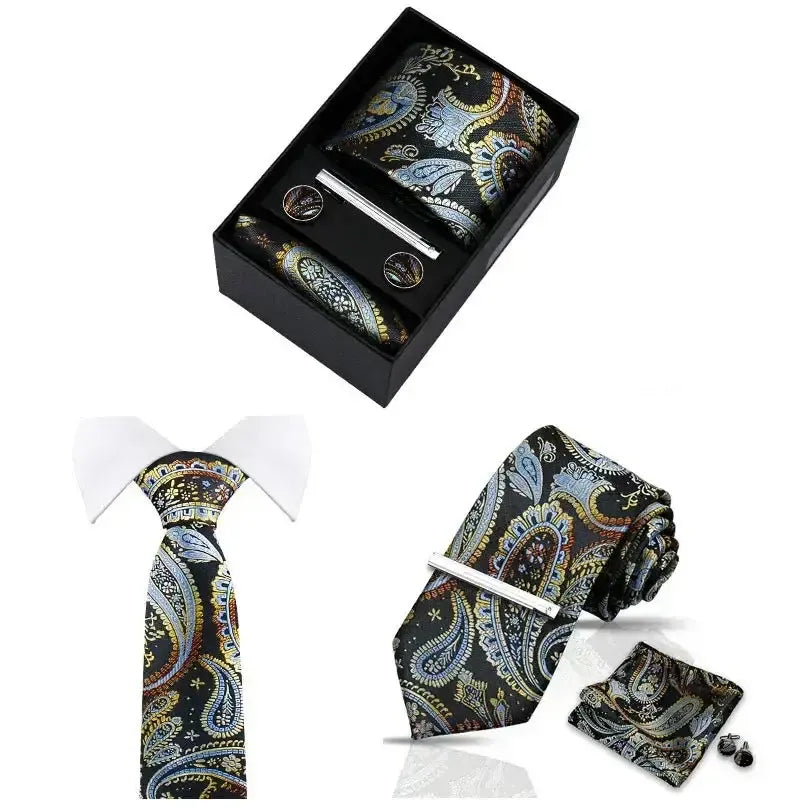 Set de corbata, pañuelo y gemelos con estampado paisley en tonos azul y dorado, acabado en seda, en caja de regalo.