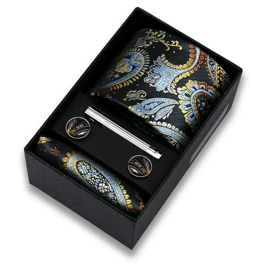 Set corbata paisley azul dorado con pañuelo, gemelos y pasador en caja elegante.