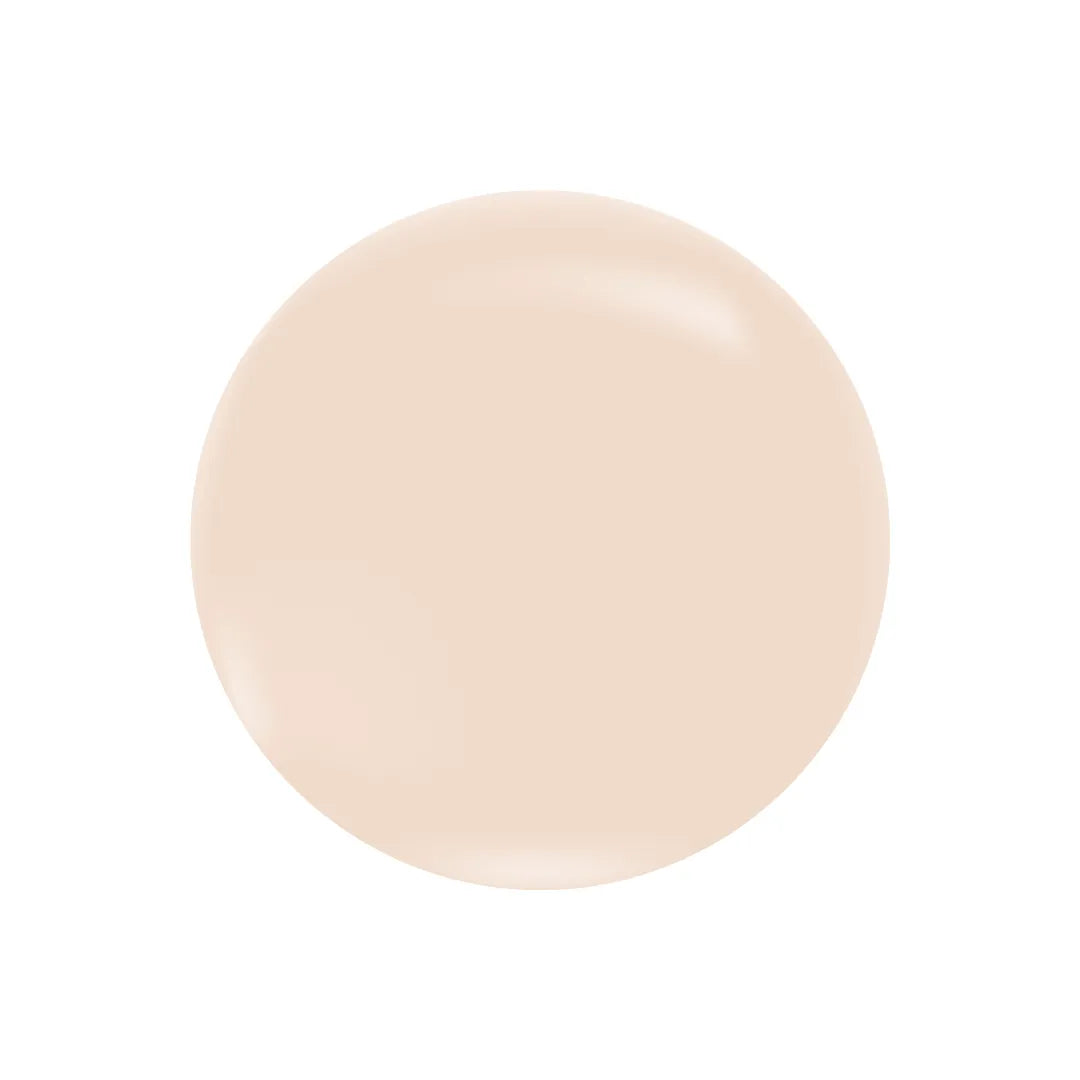 A smooth, circular swatch of light beige, creamy CC cream or tinted moisturizer on a white background.