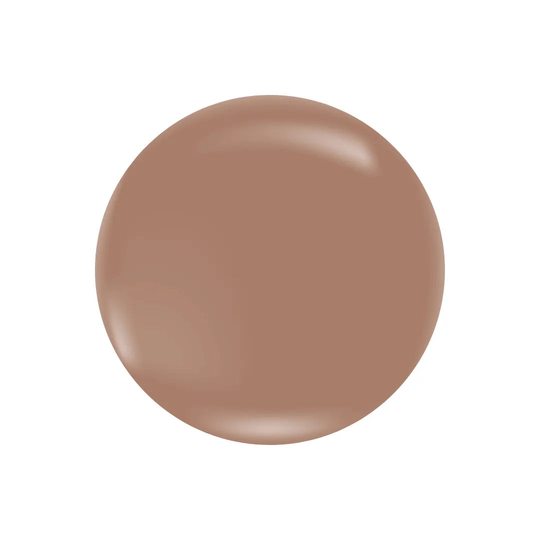 A smooth, circular swatch of light brown tinted moisturizer with a glossy, creamy texture on a white background.