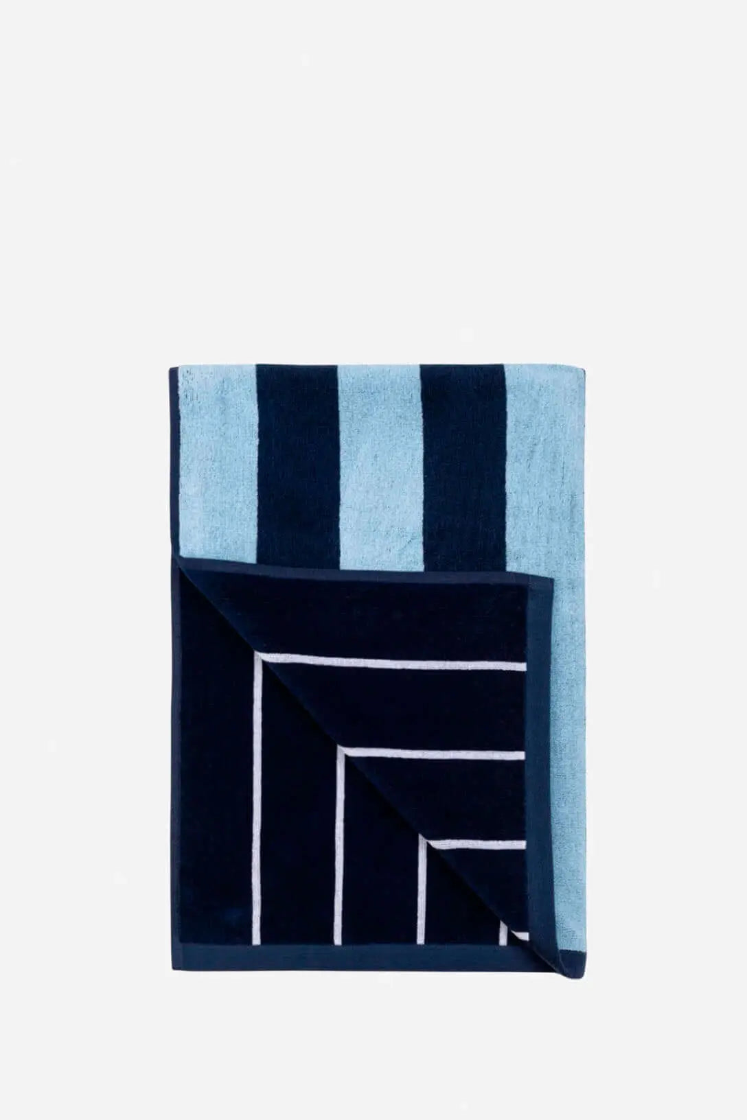 Folded beach towel with navy and light blue vertical stripes, and a contrasting navy underside with white pinstripes.