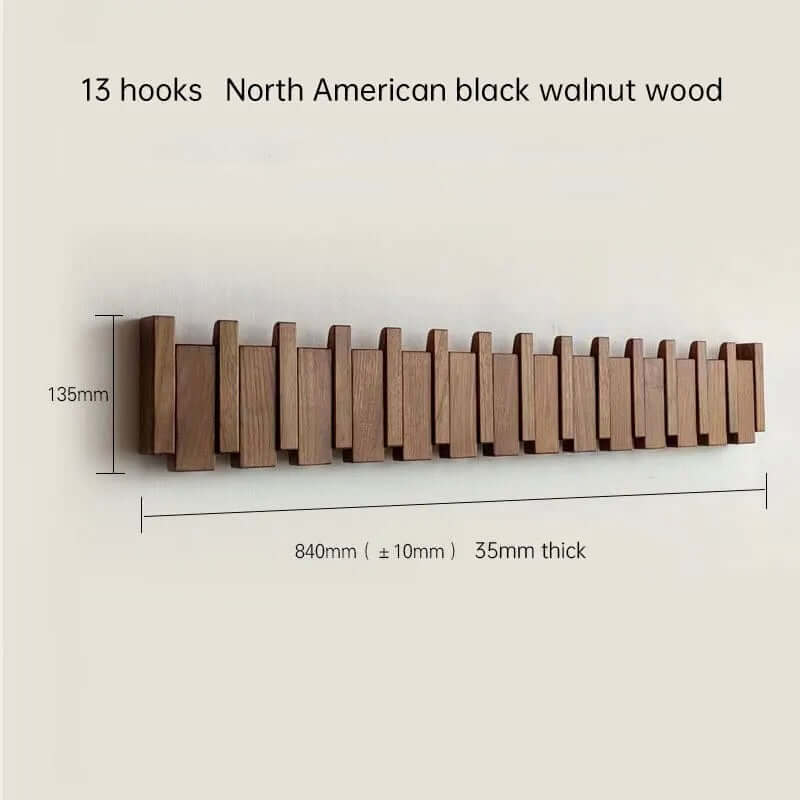 Perchero de pared de madera oscura con 13 ganchos plegables, diseño minimalista y lineal de estilo escandinavo.