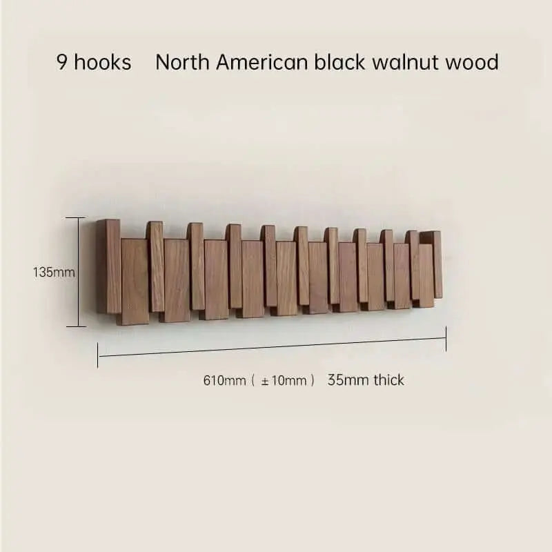 Perchero de pared de madera natural con 9 ganchos plegables de estilo nórdico y diseño minimalista en tono oscuro.