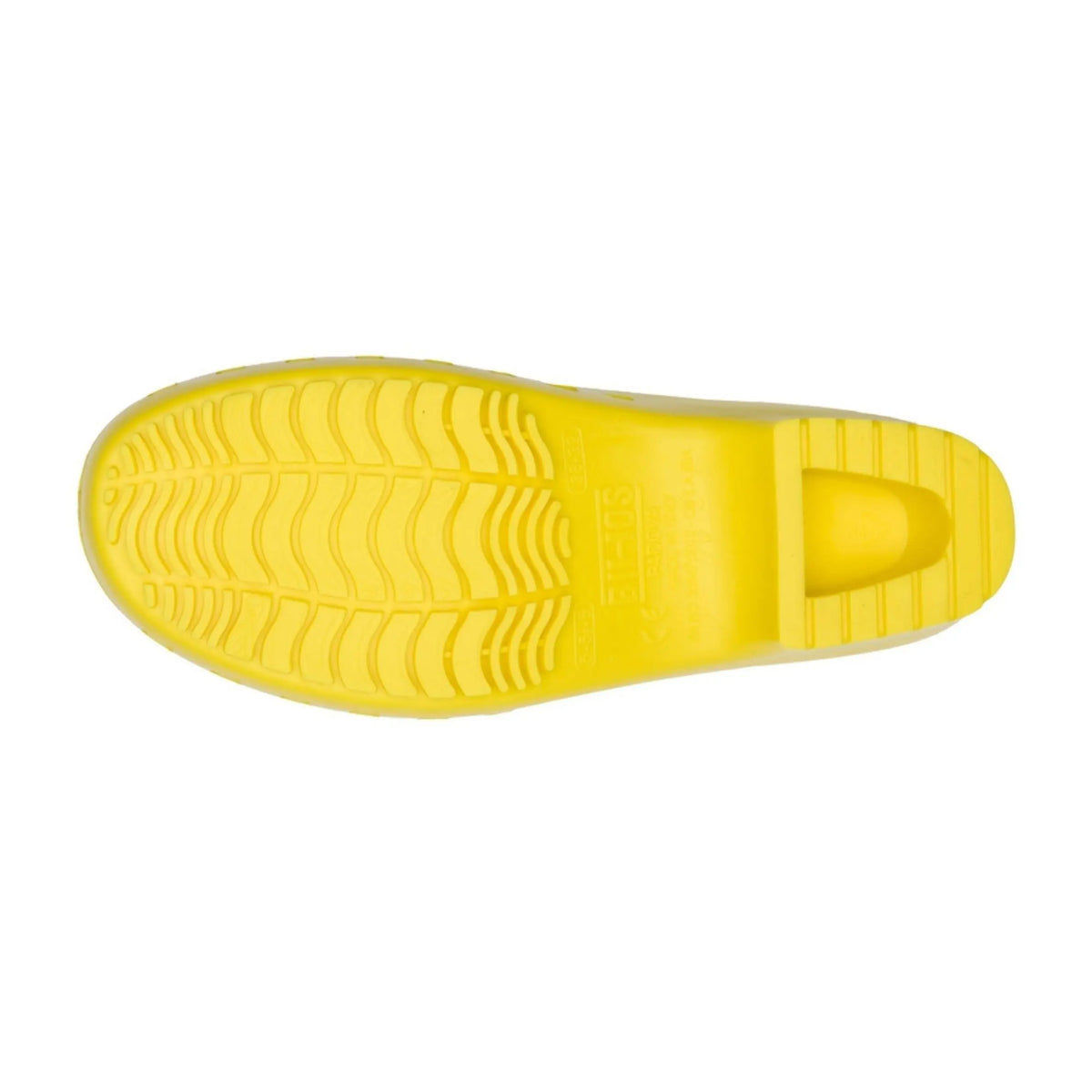 Bottom view of a yellow, hole-free clog with a molded, wave-patterned rubber tread and heel indentation.