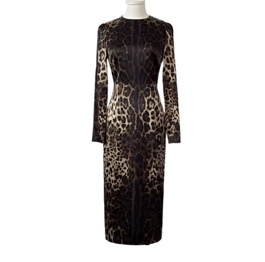 Leopard print long-sleeve dress in shades of brown and black, elegant fitted style, perfect for evening events.