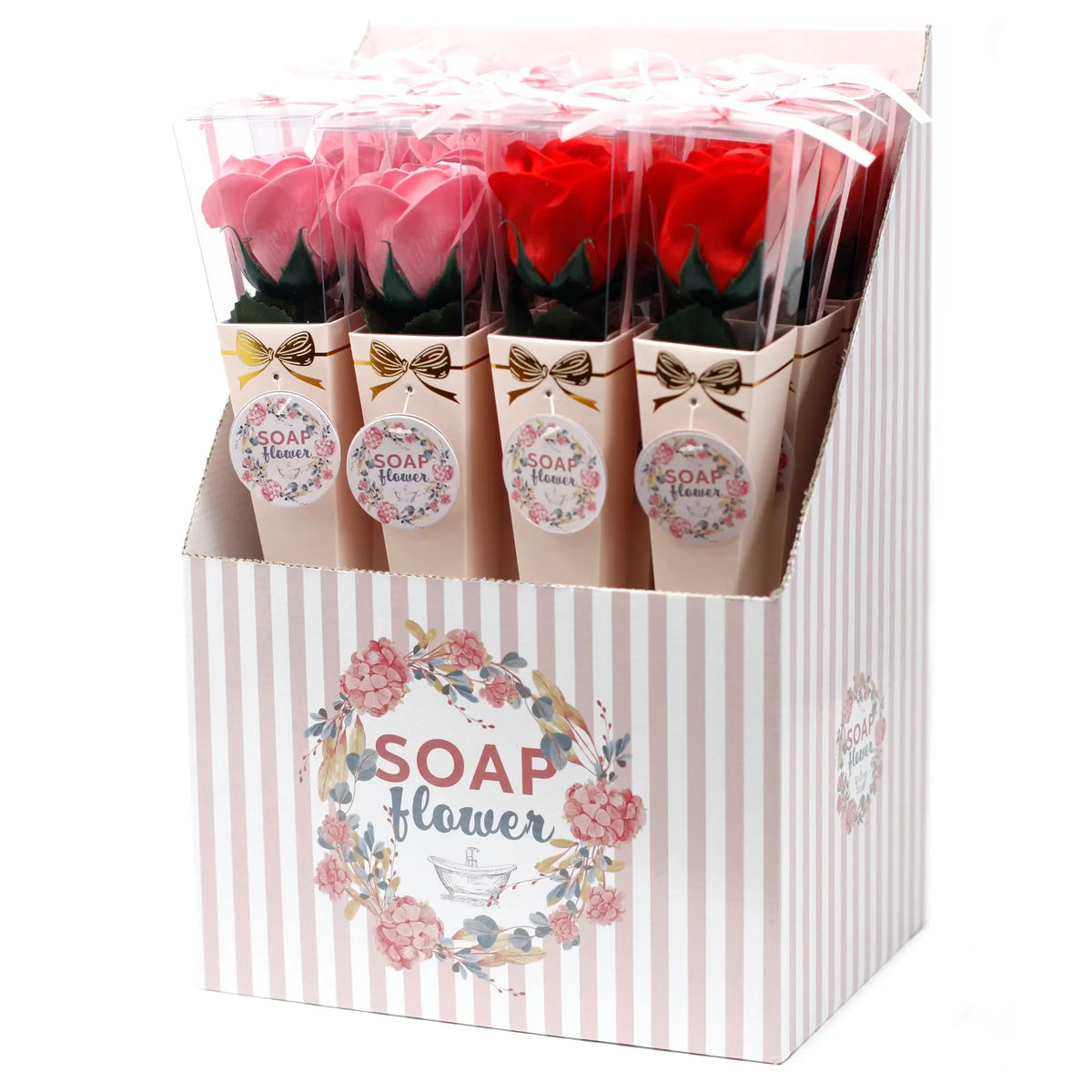 Expositor con rosas de jabón en tonos rosa y rojo, presentadas en cajas individuales con lazo y etiquetas decorativas