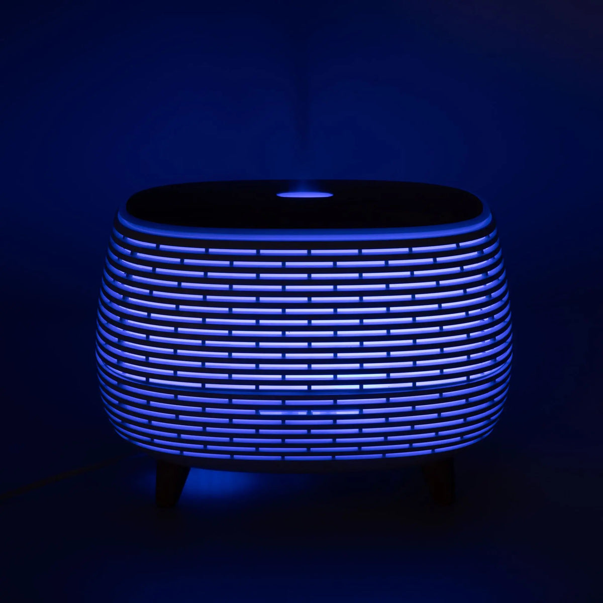 Mesita moderna de estilo nórdico, color azul, material plástico, con luz LED y patas de madera.