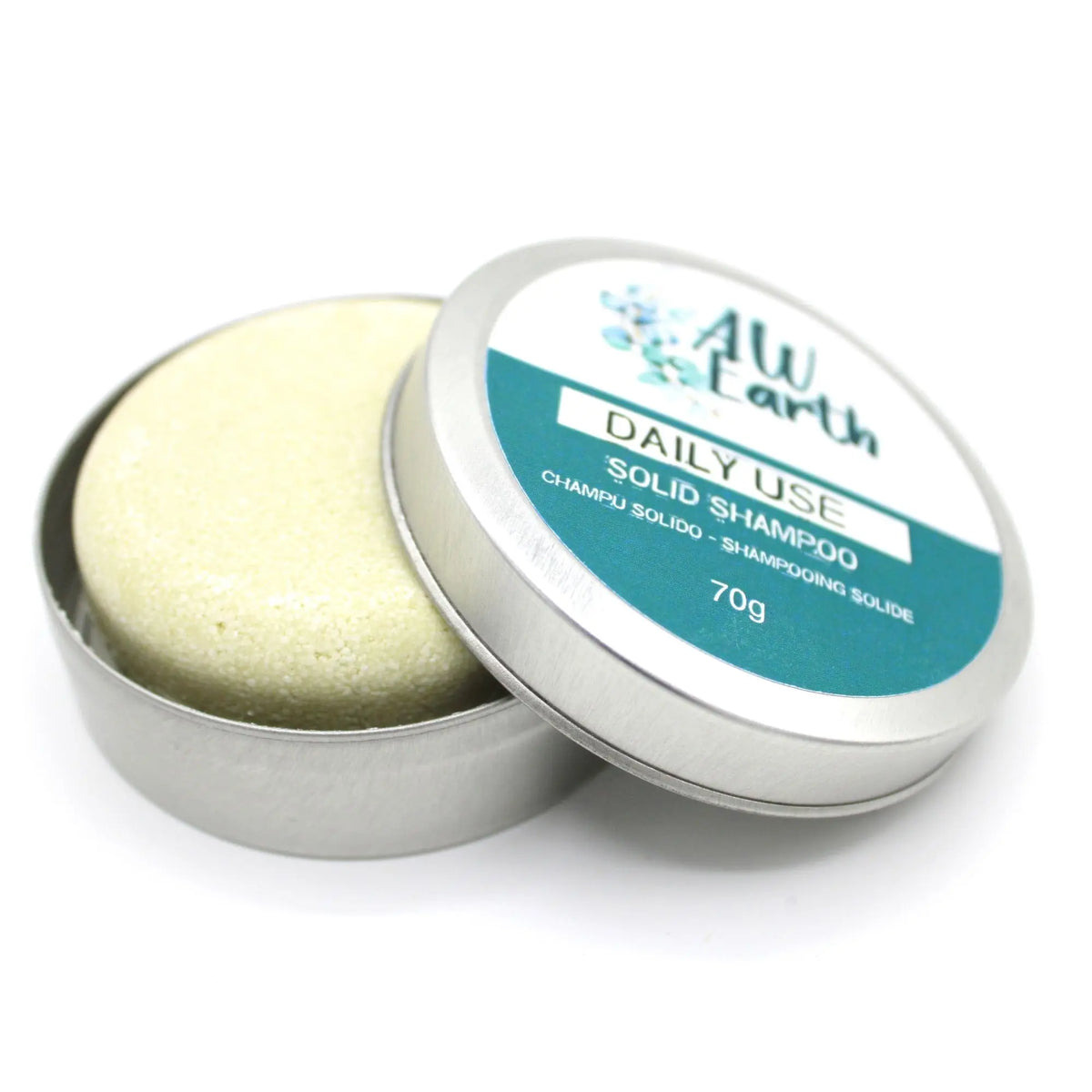 Champú sólido Ancient Wisdom de 70g en lata metálica redonda con etiqueta verde y blanca, sobre fondo blanco.