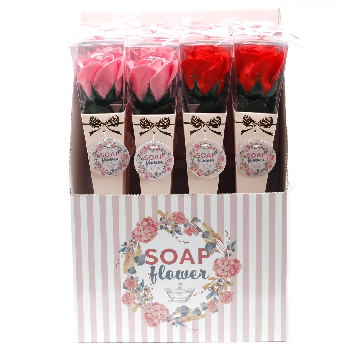 Expositor con rosas de jabón en tonos rosa y rojo, presentadas en conos individuales con lazo y etiquetas decorativas