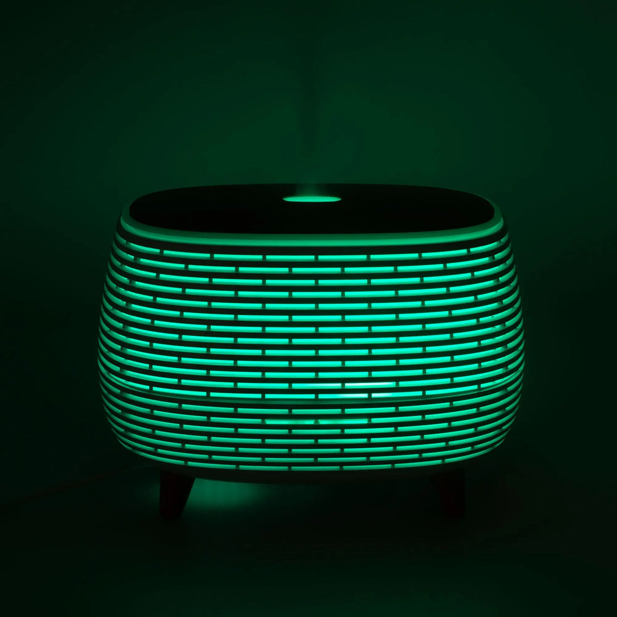 Mesa de luz moderna, verde y negra, de diseño elegante, con luz LED y textura de rejilla.