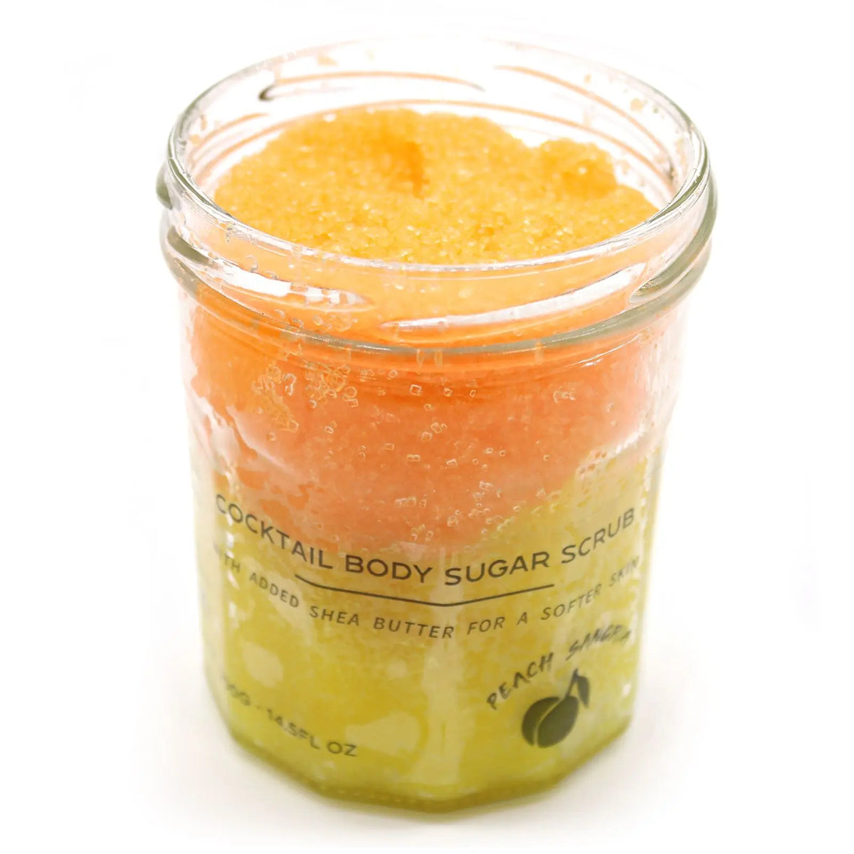 Frasco de vidrio con exfoliante de azúcar en capas naranja y amarilla, con etiqueta informativa sobre fondo blanco.