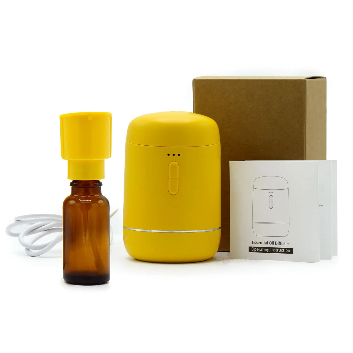 Difusor de aromas amarillo, USB-C, con frasco ámbar, cable, manual y caja. Diseño portátil, moderno y compacto.