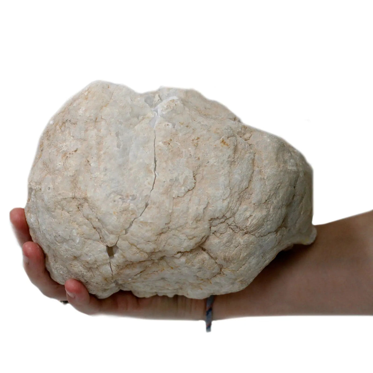 Piedra natural grande color beige, textura rugosa, ideal para decoración y manualidades.
