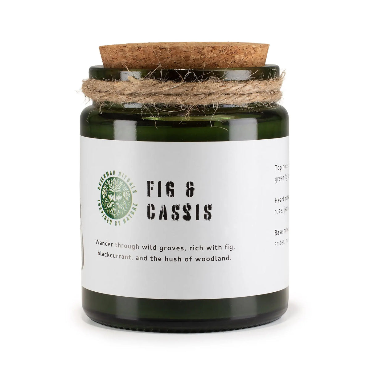 Vela verde en frasco de vidrio con tapa de corcho, aroma a higo y grosella negra. Decoración rústica.