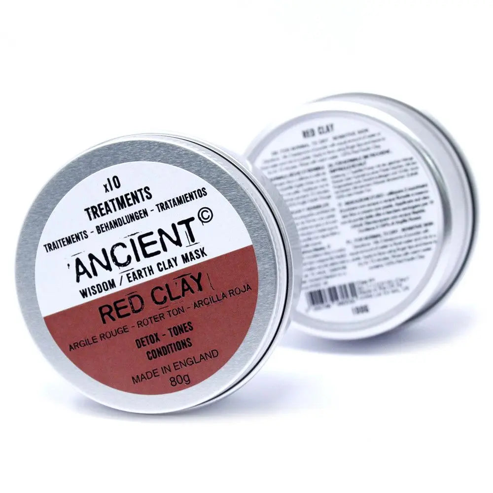 Dos latas metálicas circulares de 80g de mascarilla facial de arcilla roja sobre fondo blanco.