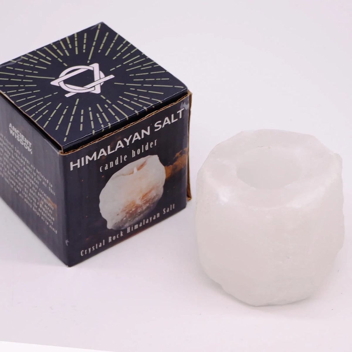 Portavelas de sal del Himalaya blanca con textura natural junto a su caja de embalaje sobre fondo neutro