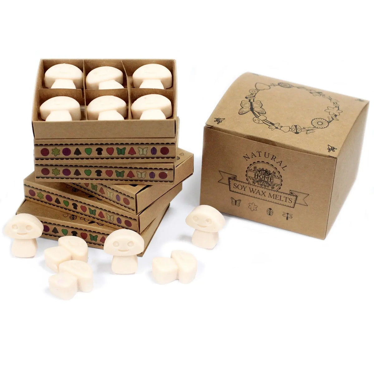 Caja de regalo con 6 ceras de soja en forma de seta color crema, junto a varias piezas sueltas sobre fondo blanco.
