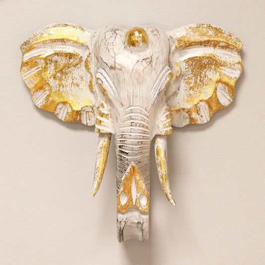 Cabeza de elefante decorativa blanca y dorada, tallada en madera con acabado envejecido, estilo bohemio.