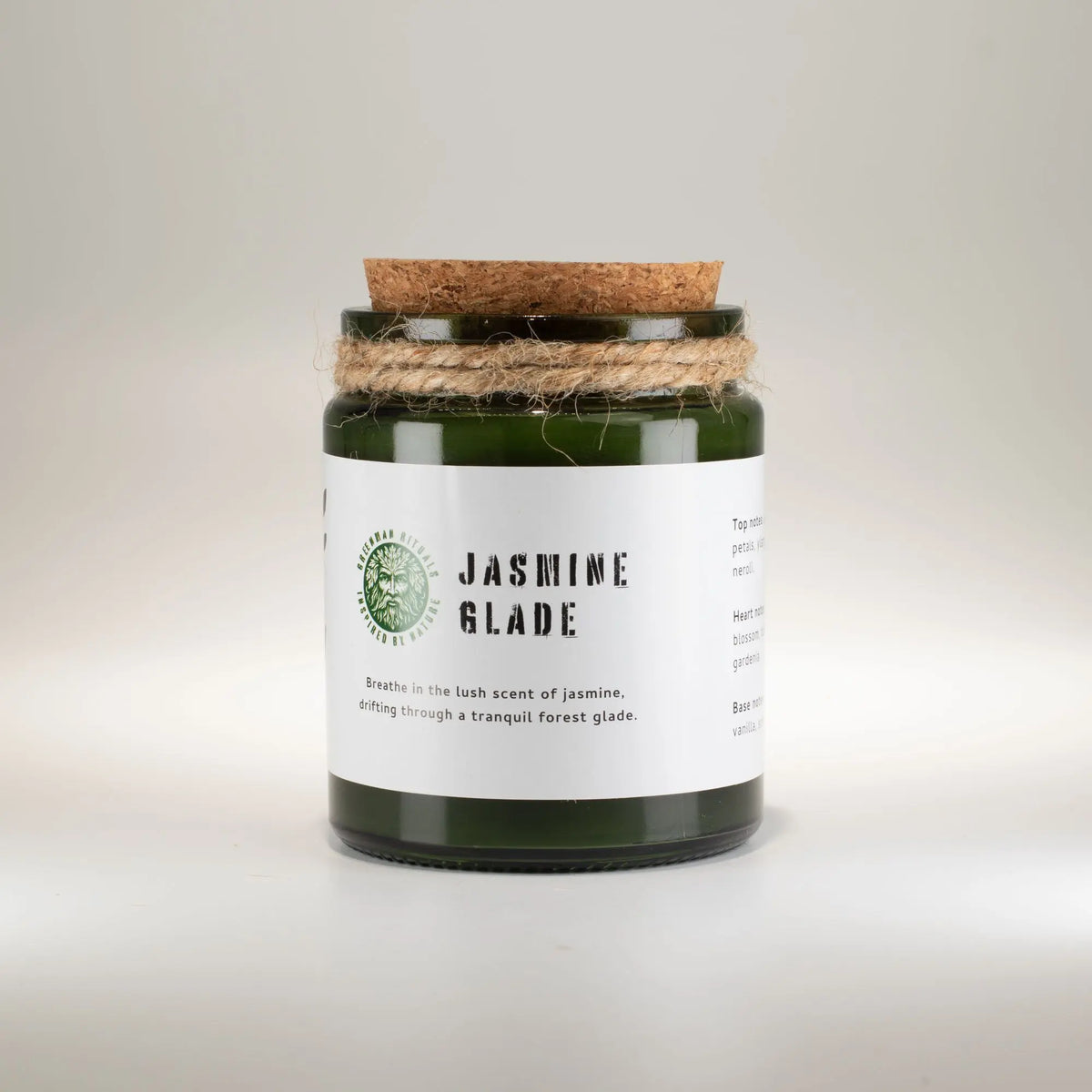 Vela aromática verde con tapa de corcho, fragancia a jazmín, estilo natural y decorativo.