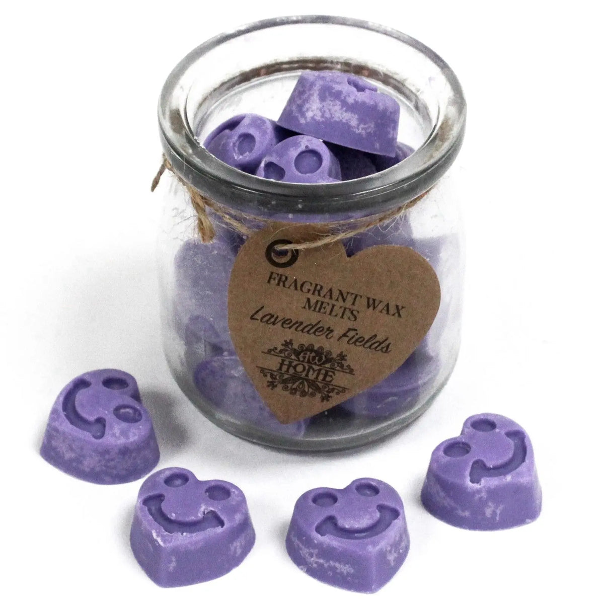 Frasco de vidrio con pastillas de cera de soja moradas en forma de cara sonriente y etiqueta con forma de corazón.