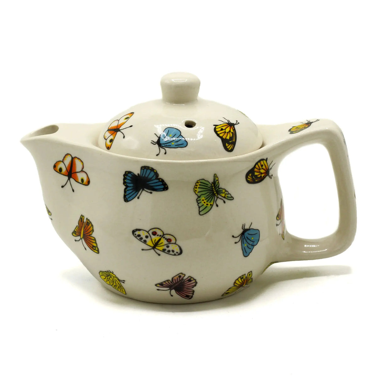 Tetera de cerámica color crema decorada con coloridas mariposas pintadas, de 17 cm, con tapa y asa lateral.