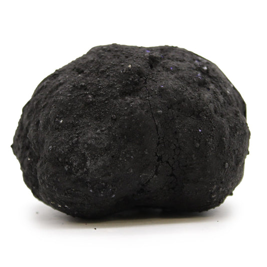 Piedra de carbón negra, textura rugosa y irregular, ideal para parrillas y chimeneas.