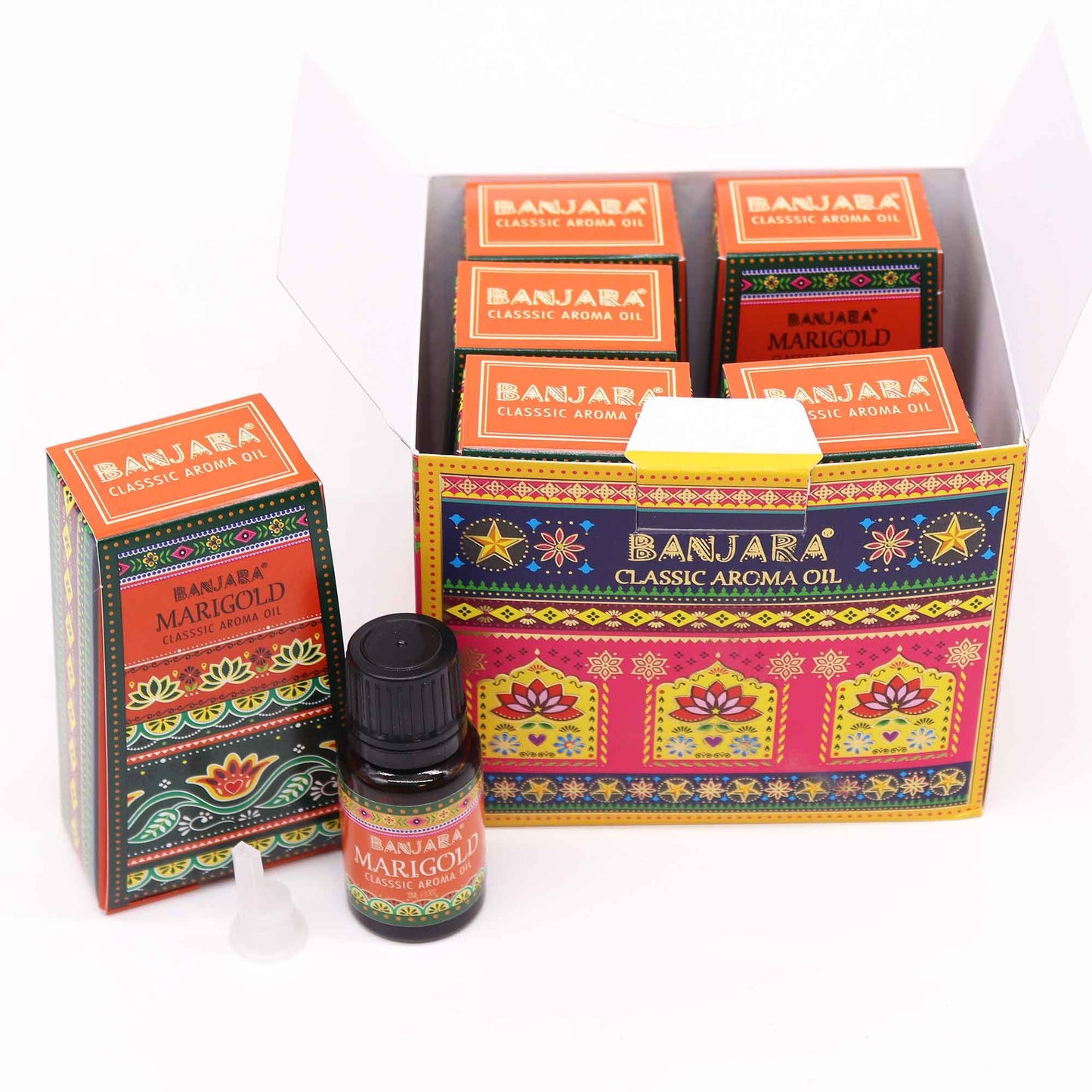 Caja con frascos de aceite esencial de caléndula, diseño colorido con patrones tradicionales indios sobre fondo blanco.
