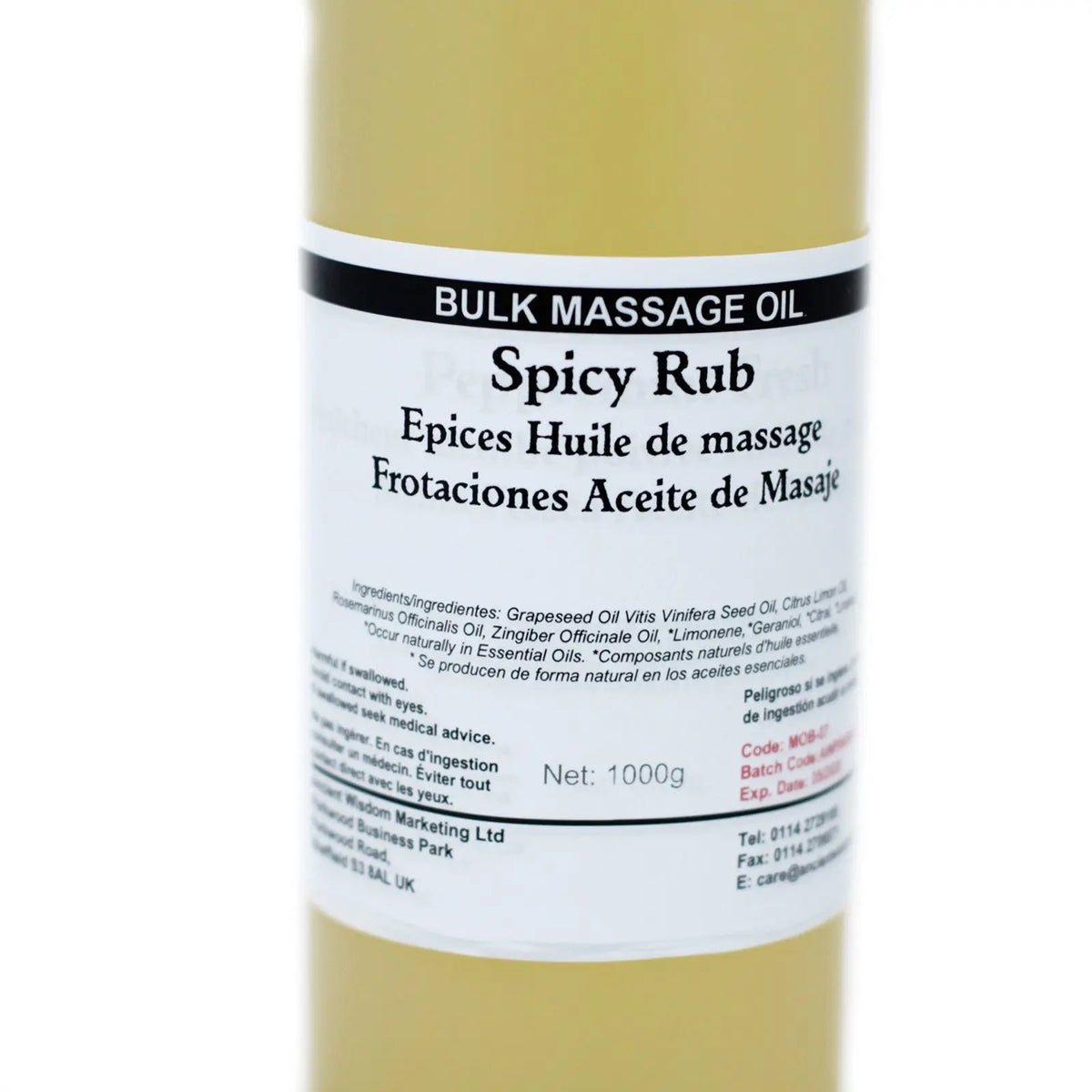 Botella cilíndrica de 1 kg con aceite de masaje amarillo y etiqueta blanca informativa sobre fondo neutro.