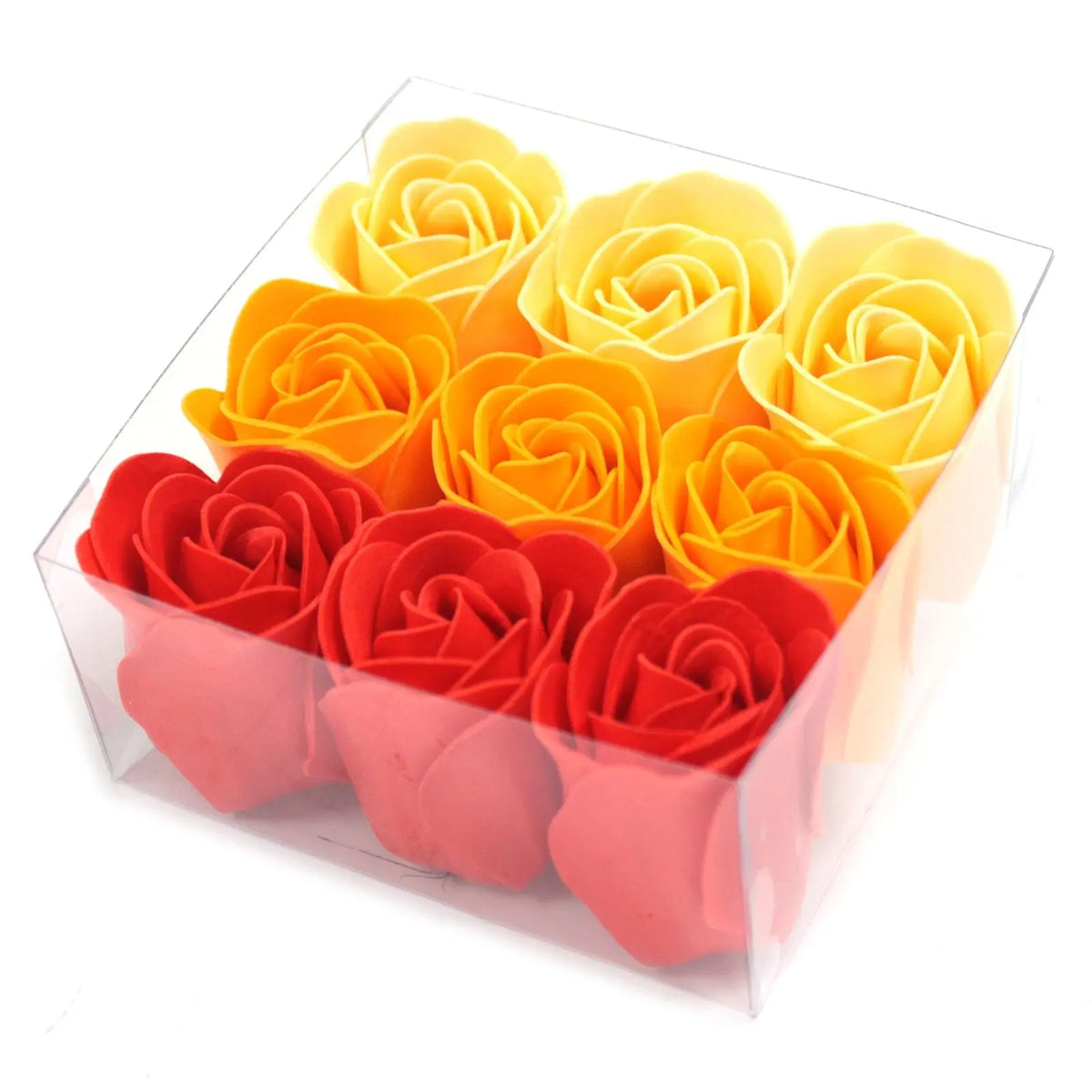 Caja transparente con 9 rosas de jabón en degradado, desde tonos amarillos hasta rojos intensos.