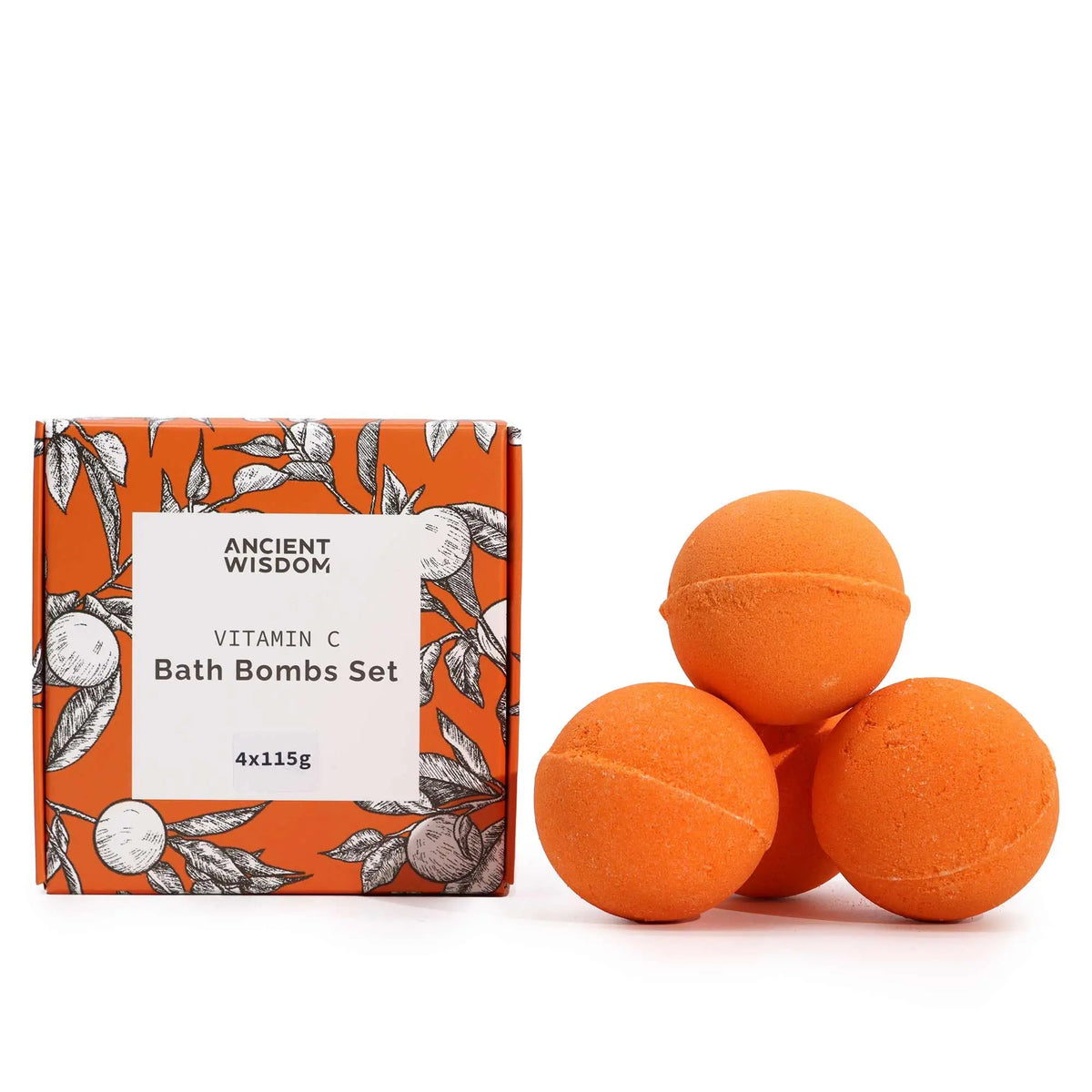 Cuatro bombas de baño esféricas de color naranja junto a su caja de cartón con diseño botánico de marca Ancient Wisdom.