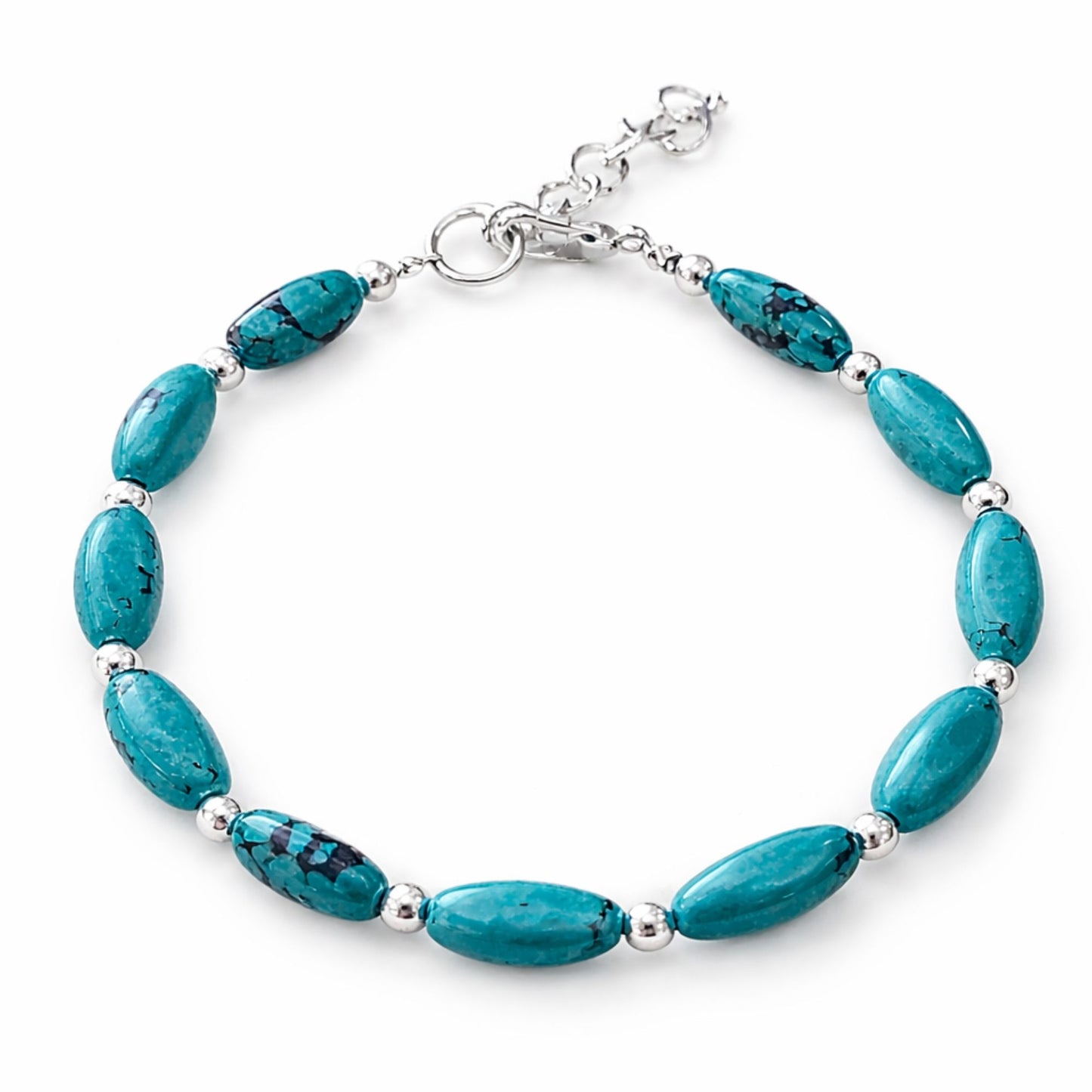 Pulsera de turquesa ovalada con detalles plateados, estilo elegante y vibrante, ideal para cualquier ocasión.
