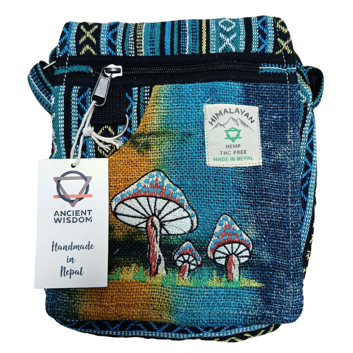 Bolso de cáñamo azul y amarillo con bordado de setas, estampado geométrico, cremallera frontal y etiqueta colgante.