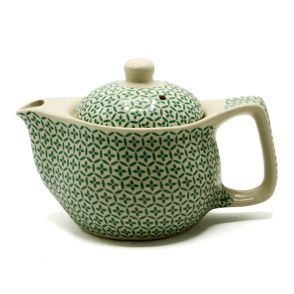 Tetera de cerámica 350ml con patrón de mosaico verde sobre fondo crema, tapa incluida y asa ergonómica.