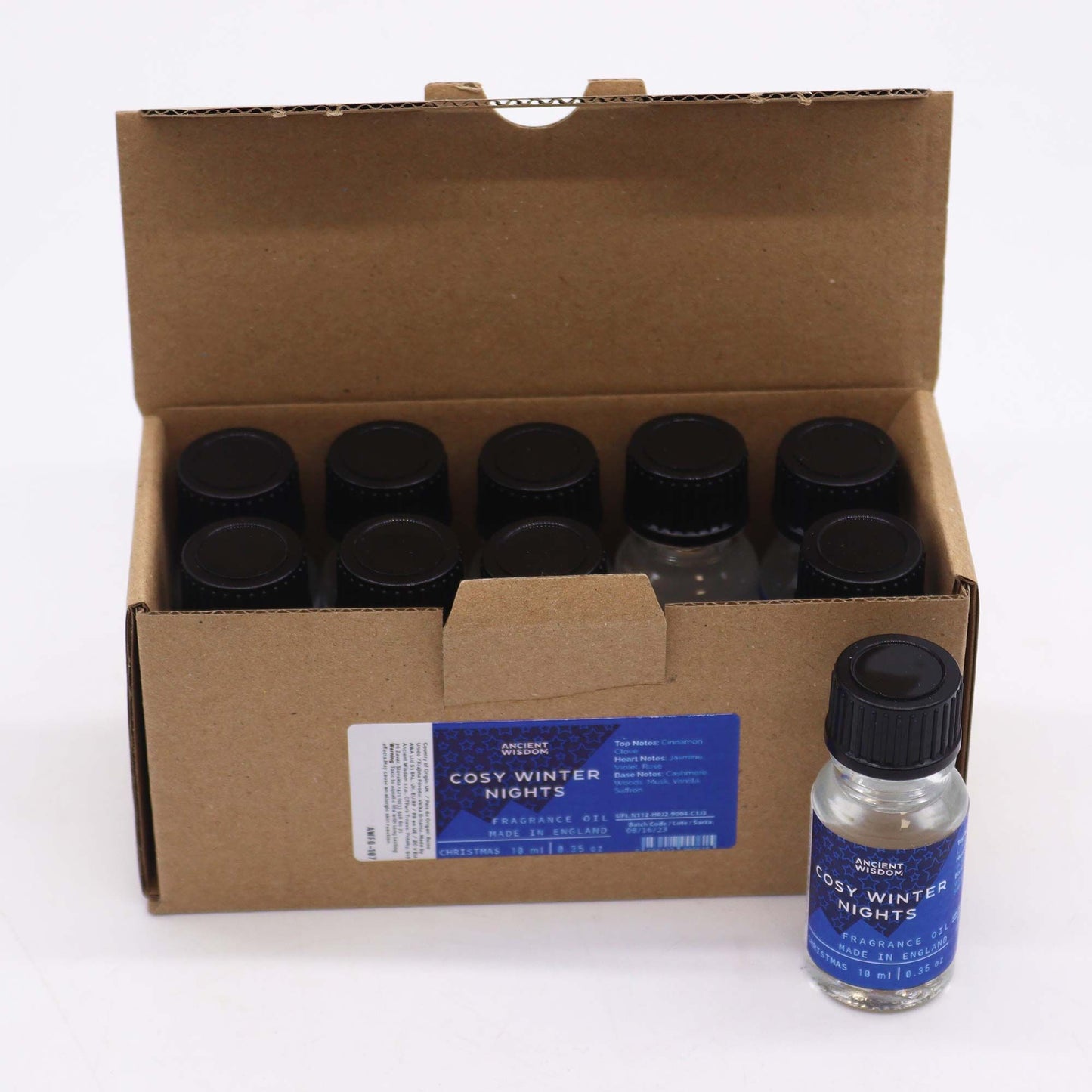 Caja de cartón con 10 frascos de vidrio de 10 ml de aceite aromático con tapa negra y etiqueta azul.