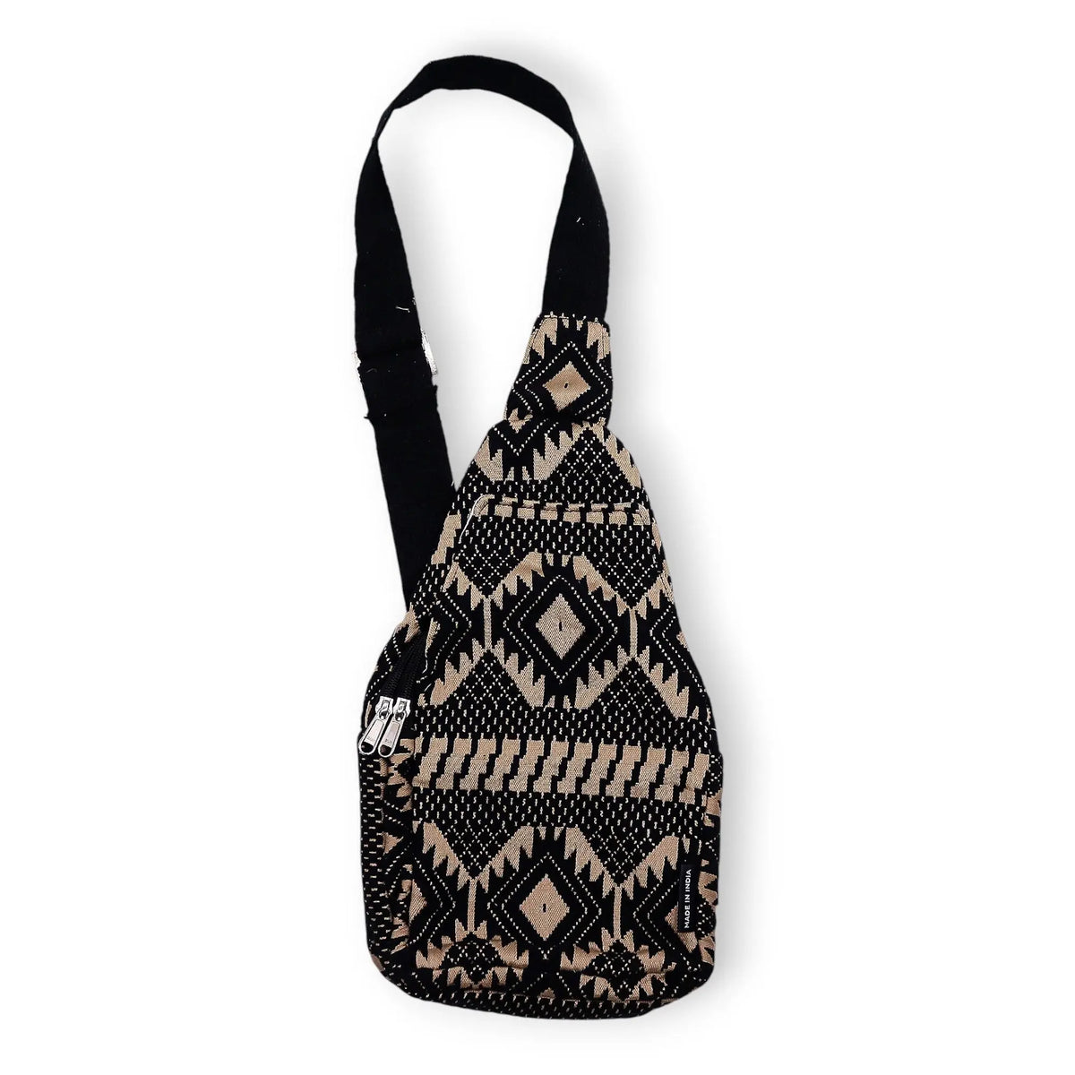 Bandolera negra y beige con patrón étnico, fabricada en algodón, ideal para un estilo bohemio y casual.