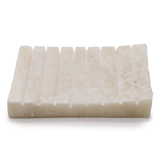 Jabonera rectangular de ónix blanco Ancient Wisdom, piedra natural con ranuras para drenaje, acabado elegante y rústico.