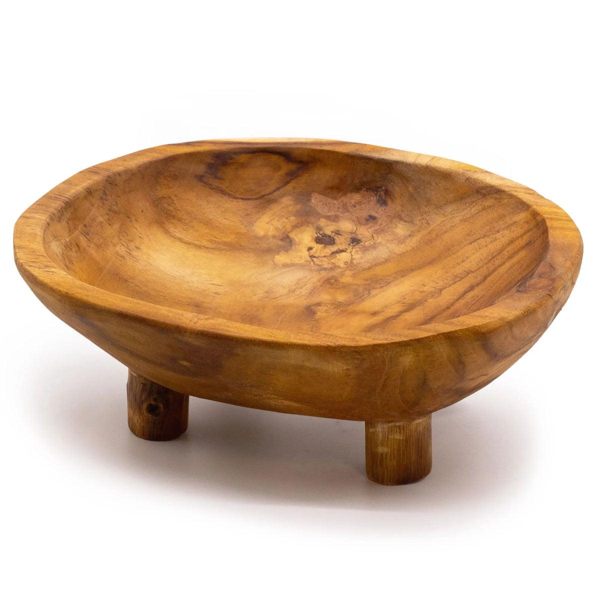 Frutero de madera de teca con vetas naturales, forma ovalada y tres patas cortas, sobre fondo blanco.