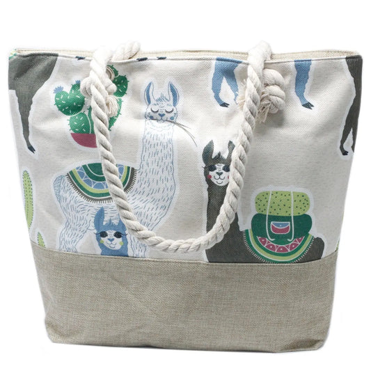 Bolso shopper de tela con estampado de llamas y cactus, base de yute y asas de cuerda trenzada en color blanco.