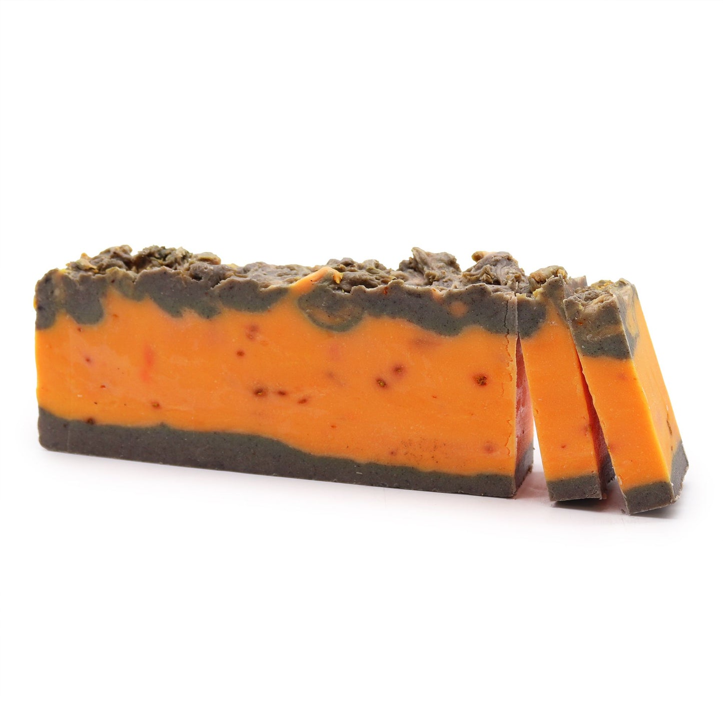 Barra de jabón artesanal Ancient Wisdom, bicolor naranja y marrón, textura rústica, aroma a canela y naranja.