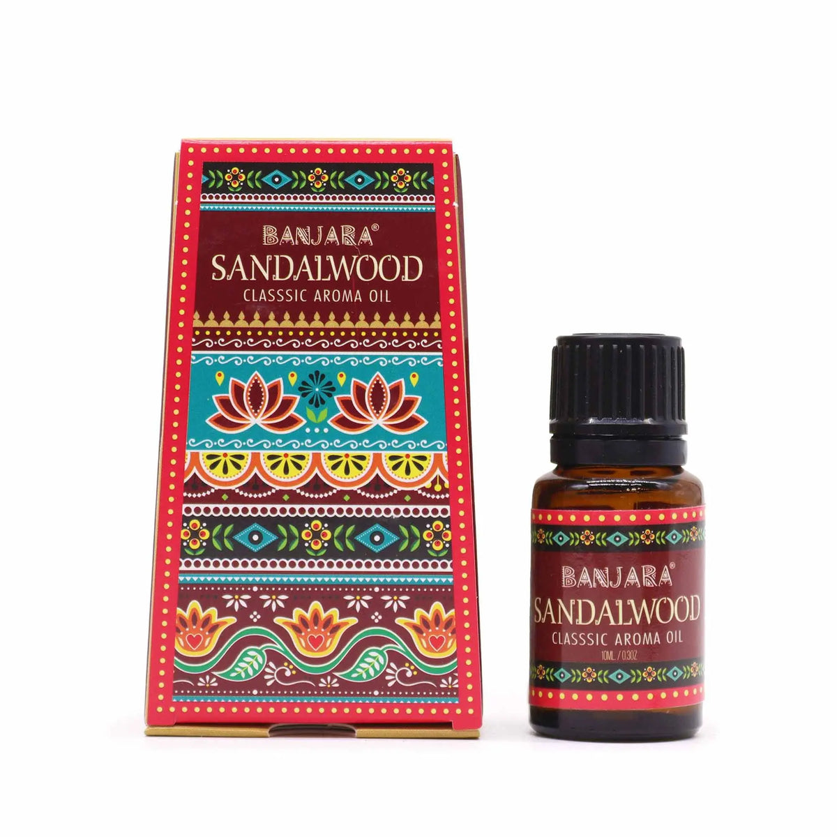 Frasco de aceite esencial de sándalo de 10ml junto a su caja rectangular con coloridos motivos florales indios.
