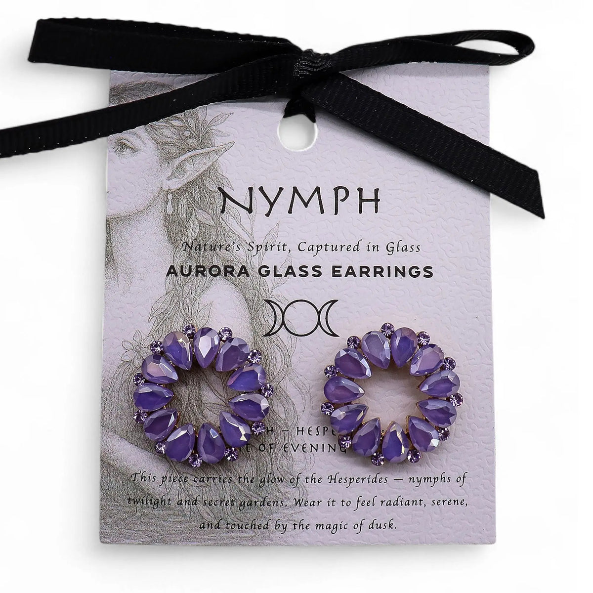Pendientes de aro con cristales vintage color lavanda en forma de lágrima sobre tarjeta de presentación.