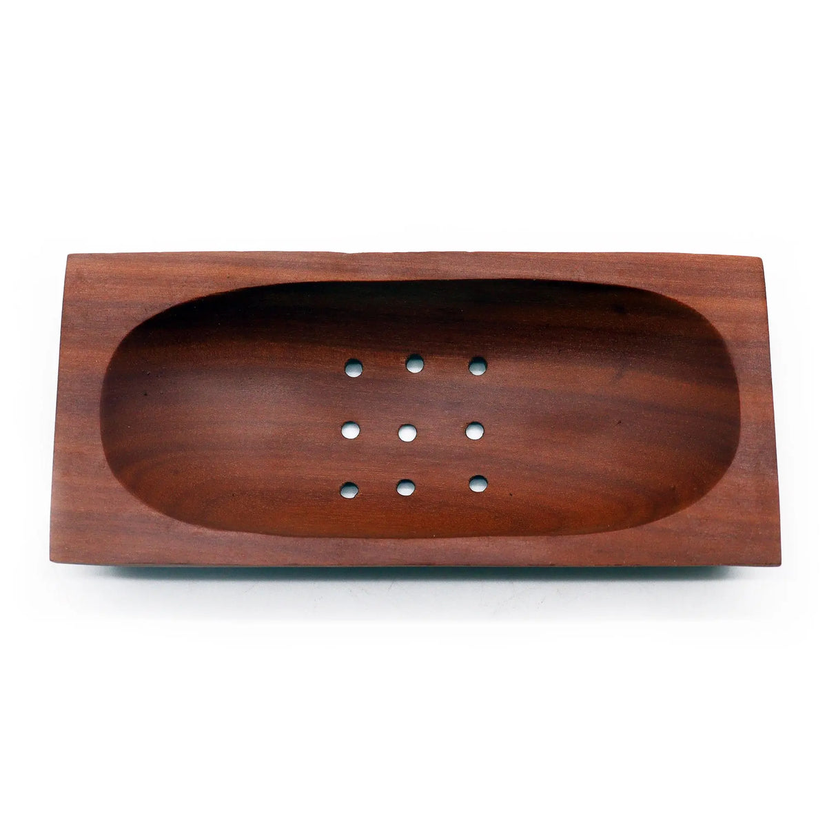 Jabonera rectangular de madera de caoba color marrón oscuro con orificios de drenaje. Diseño artesanal.