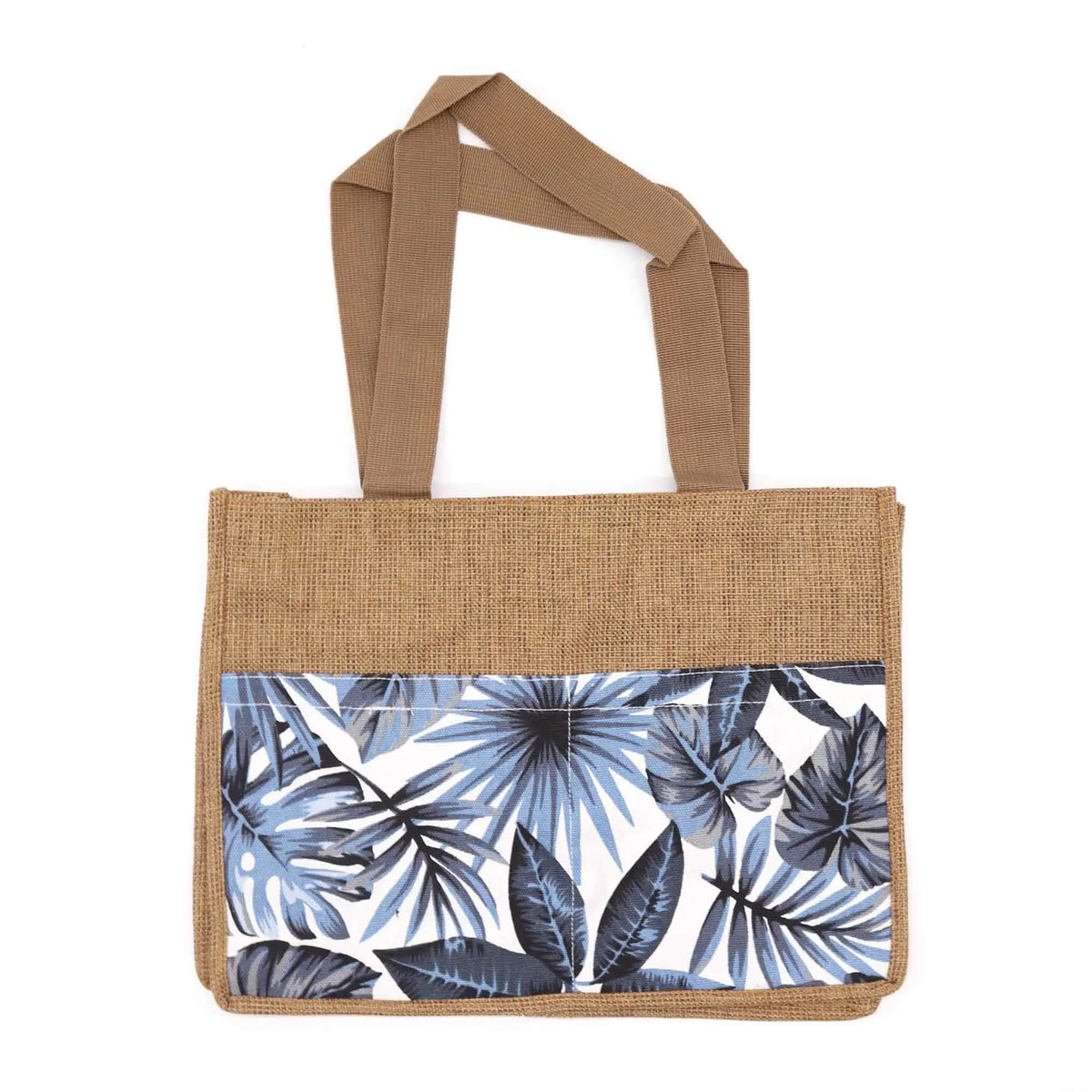 Bolsa de yute con asas marrones y bolsillo frontal estampado con hojas tropicales en tonos azules y blanco.