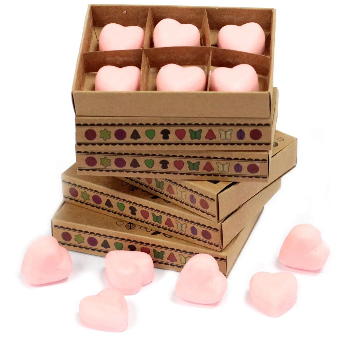 Cajas de cartón con 6 ceras aromáticas en forma de corazón color rosa pastel sobre fondo blanco.