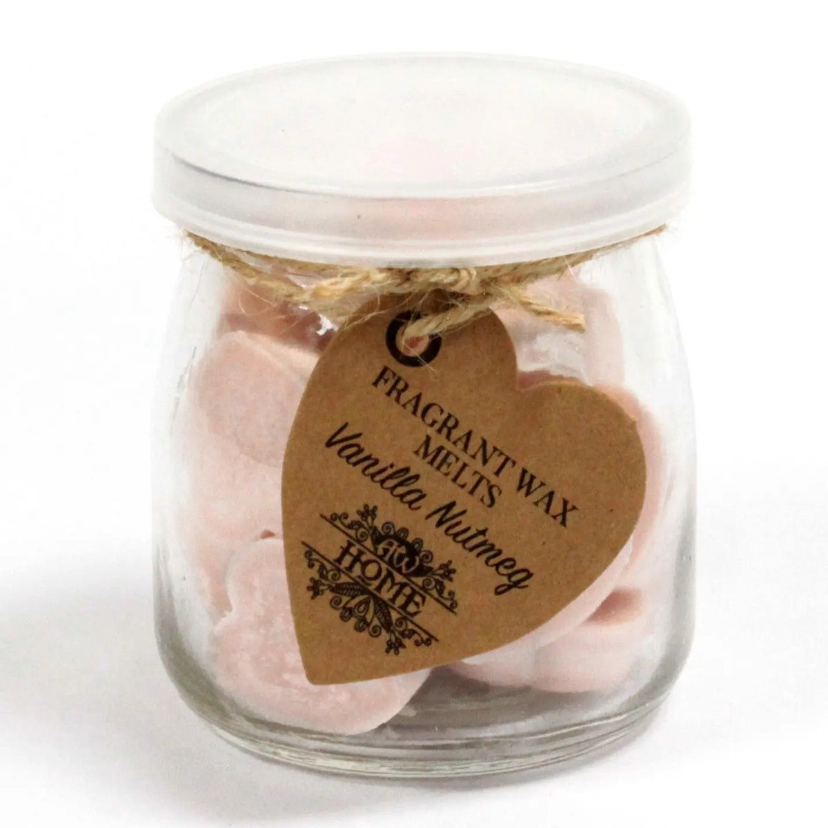 Frasco de vidrio con tapa blanca lleno de corazones de cera rosados y etiqueta artesanal de cartón en forma de corazón.
