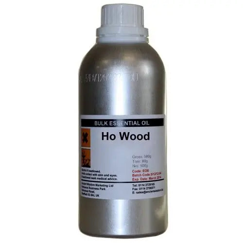 Aceite esencial de Ho Wood, envase metálico plateado, 500 ml, aroma woody, ideal para aromaterapia y productos naturales.