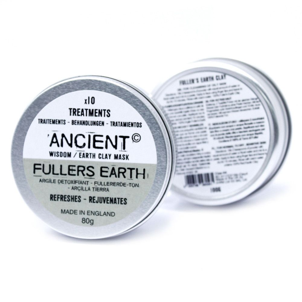 Dos latas redondas de metal con etiqueta blanca que contiene información de mascarilla facial de arcilla de 80g.