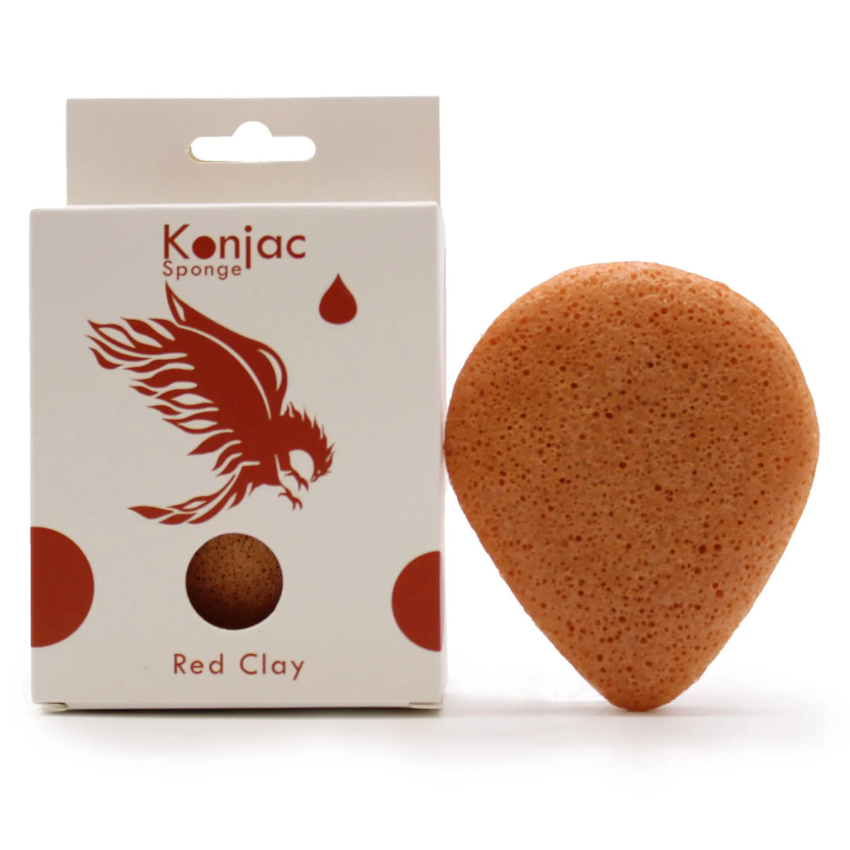 Esponja facial de konjac con arcilla roja, forma de gota, textura porosa y caja blanca con ilustración de un ave roja.