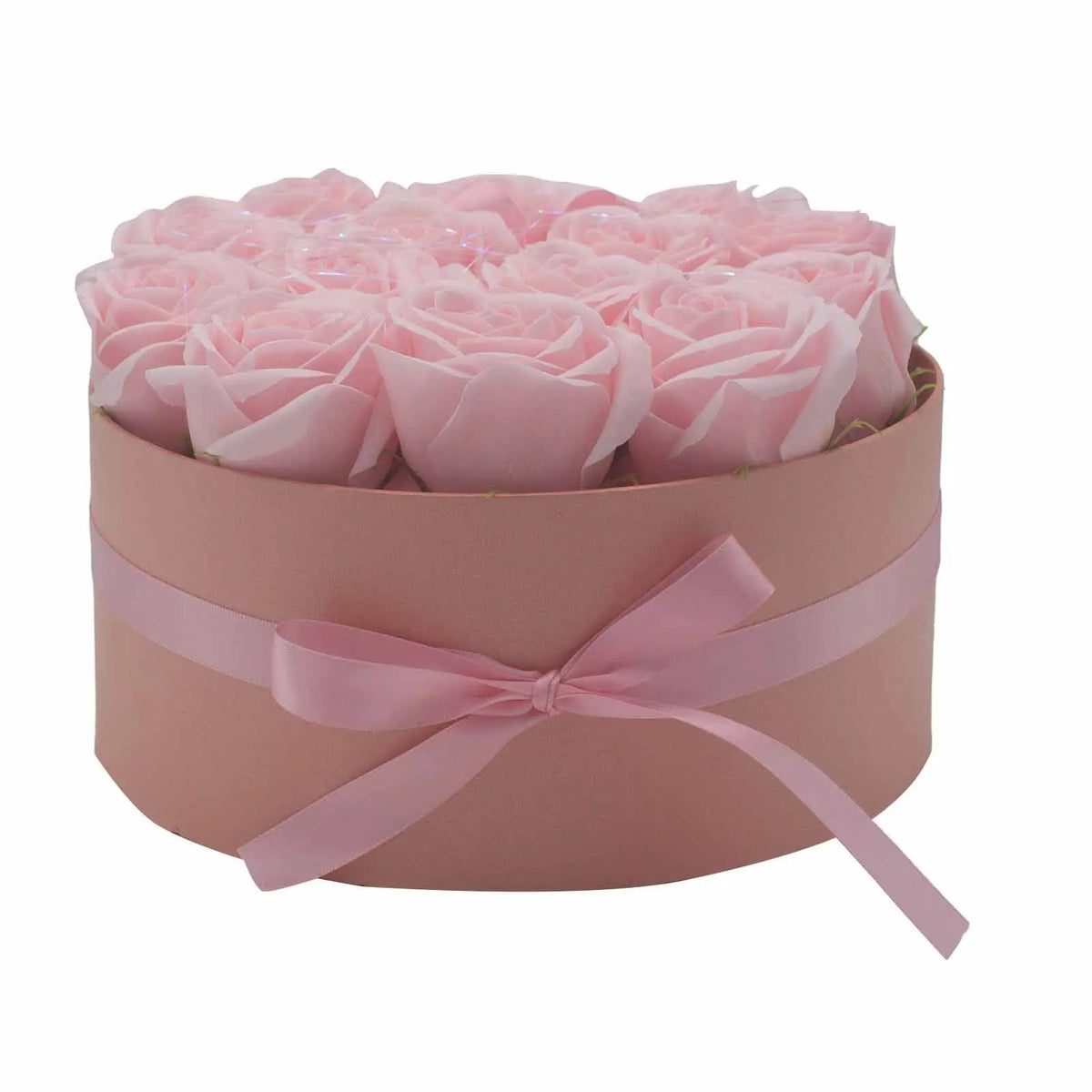 Caja redonda rosa con 14 rosas de jabón del mismo color, decorada con un lazo de satén. Estilo elegante y romántico.
